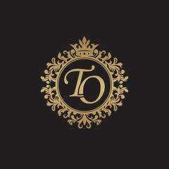 Initial letter TO, overlapping monogram logo, decorative ornament badge, elegant luxury golden color