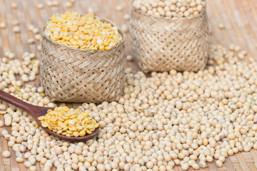 soy beans in bammboo basket  on wood background.