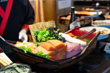 Japanese chef making sushi at restaurant