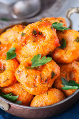 Traditional Turkish food - fellah koftes, polpettes from bulgur and semolina in tomato sauce with parsley and ayran. Middle eastern food concept.