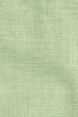 Hessian sackcloth woven texture pattern background in light pale green earth color