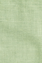 Hessian sackcloth woven texture pattern background in light pale green earth color