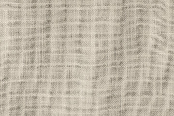Fototapeta na wymiar Hessian sackcloth woven texture pattern background in light sepia cream beige brown color