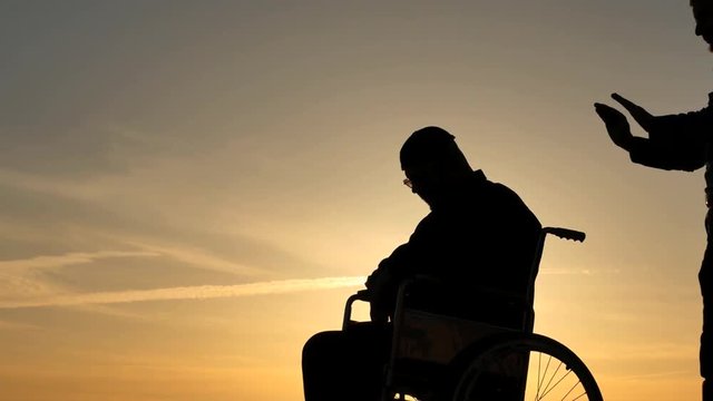 psychic medium making a session with patient silhouettes on sky background