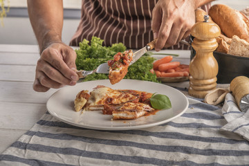cooking healthy diet food in the home kitchen, Healthy Chicken parmesan