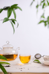 Cups of tea on wooden table background
