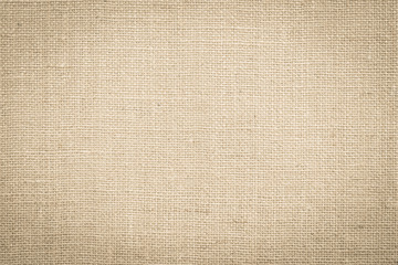 Fototapeta na wymiar Hessian sackcloth woven fabric texture background in beige cream brown color