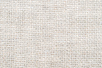Hessian sackcloth woven texture pattern background in light white pastel beige cream color