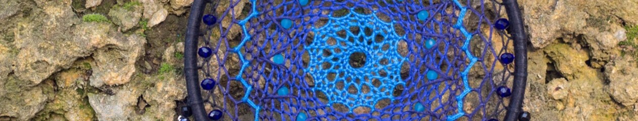 Banner of Handmade dream catcher with feathers threads and beads rope hanging