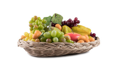 Ripe fresh fruit in basket isolated