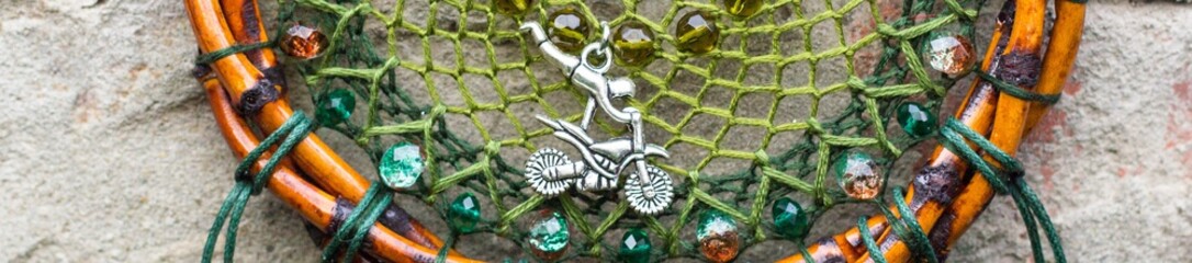 Banner of Dreamcatcher made of feathers, leather, beads, and ropes