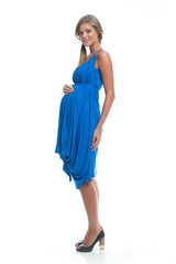 Beautiful Woman Pregnant model in blue dress on white isolated background posing. Clothes for pregnant women.