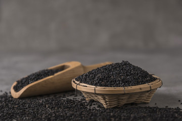 Black Sesame on wooden spoon.
