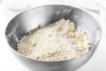 Ready-made Mexican corn tortilla: corn flour, wheat flour and butter mix in a bowl until crumbly