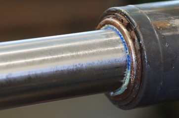 Piston rod focused on scraper ring