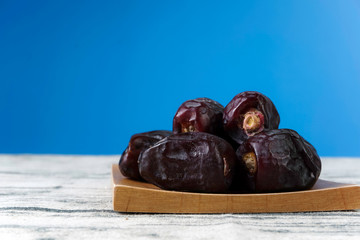 The dates on a wooden surface and blue background