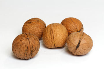 A few walnuts on white background