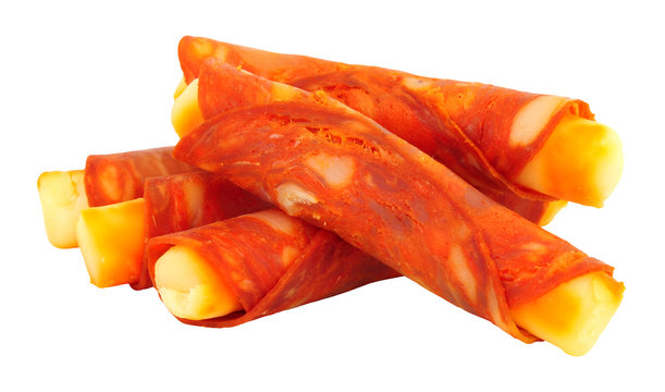 Gouda cheese wrapped in spicy Chorizo rollitos isolated on a white background