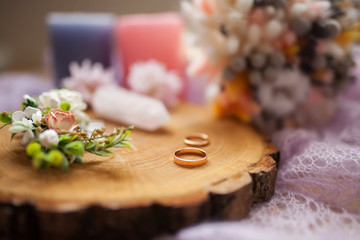 Rusic style wedding, natural decorations. Wood, flowers and wedding rings