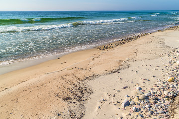 Boda coast eastern nature reserve on Oland, Sweden. Polished limestones and sand on a sunny day at the beach. Horizon over water. © imfotograf