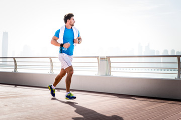 Beautiful man doing work out and different exercises outdoor