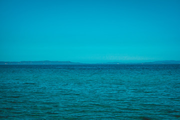 Fototapeta na wymiar blue sea with copy space in the sky