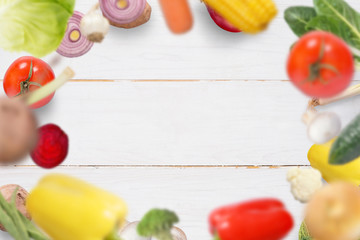 Naklejka na ściany i meble Fresh vegetables drops on white wooden kitchen table.