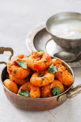 Traditional Turkish food - fellah koftes, polpettes from bulgur and semolina in tomato sauce with parsley and ayran. Middle eastern food concept.