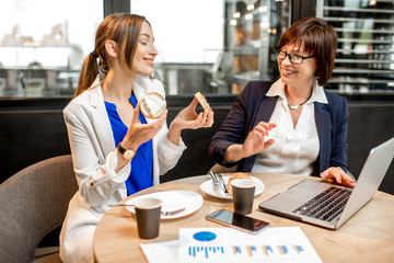 Business women during a coffee time in the cafe