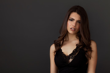 Beautiful and upset woman portrait looking at camera