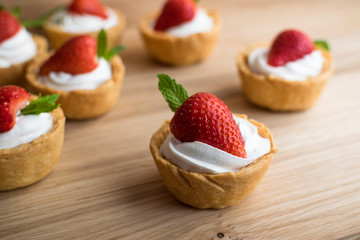 Tartlets with strawberries and whipped cream