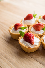 Tartlets with strawberries and whipped cream