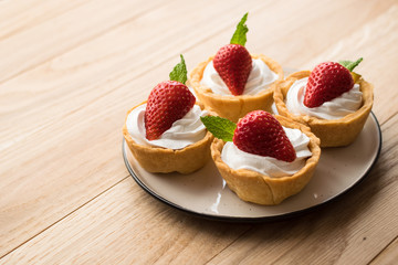 Tartlets with strawberries and whipped cream