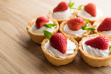 Tartlets with strawberries and whipped cream