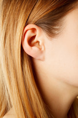 Woman's ear close up, anatomy concept