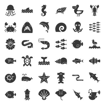 Aquatic Ocean life such as octopus, shell, pelican,herd of fish, solid icon set