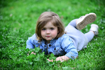 Little girl relax on spring or summer day outdoor