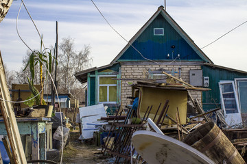 littered section of a country house, a mess in the suburban area