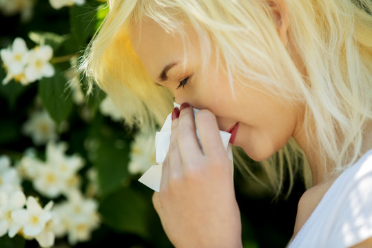 Teen Woman Blowing Her Nose Becouse Of Spring Allergy.