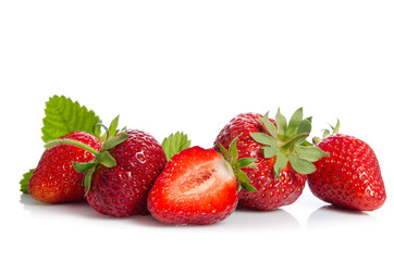 many red strawberries isolated on white