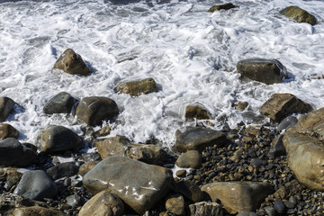 Stony beach and not a calm sea