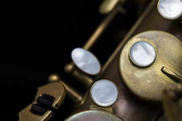 Vintage saxophone on a black background