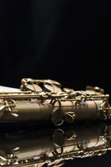 Vintage saxophone on a black background