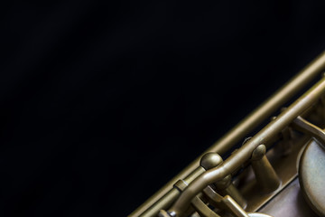 Obraz na płótnie Canvas Vintage saxophone on a black background