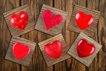 Red hearts and wooden background  -  Collage