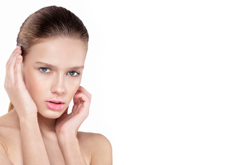 Fototapeta premium beauty of a woman's face. Natural makeup, pink lips, clean skin. Isolated white background.