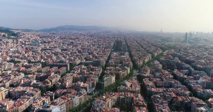 Aerial view of Barcelona Eixample district with morning light, Spain. Cityscape with typical urban blocks