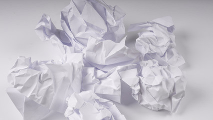 crumpled paper on white table
