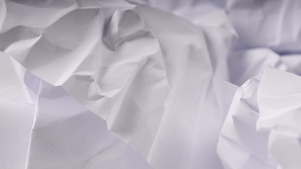 crumpled paper on white table