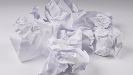 crumpled paper on white table